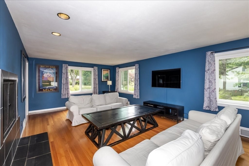 76 Woodland Road Longmeadow, MA 01106 - Photo 10 of 42 a living room with furniture and a flat screen tv