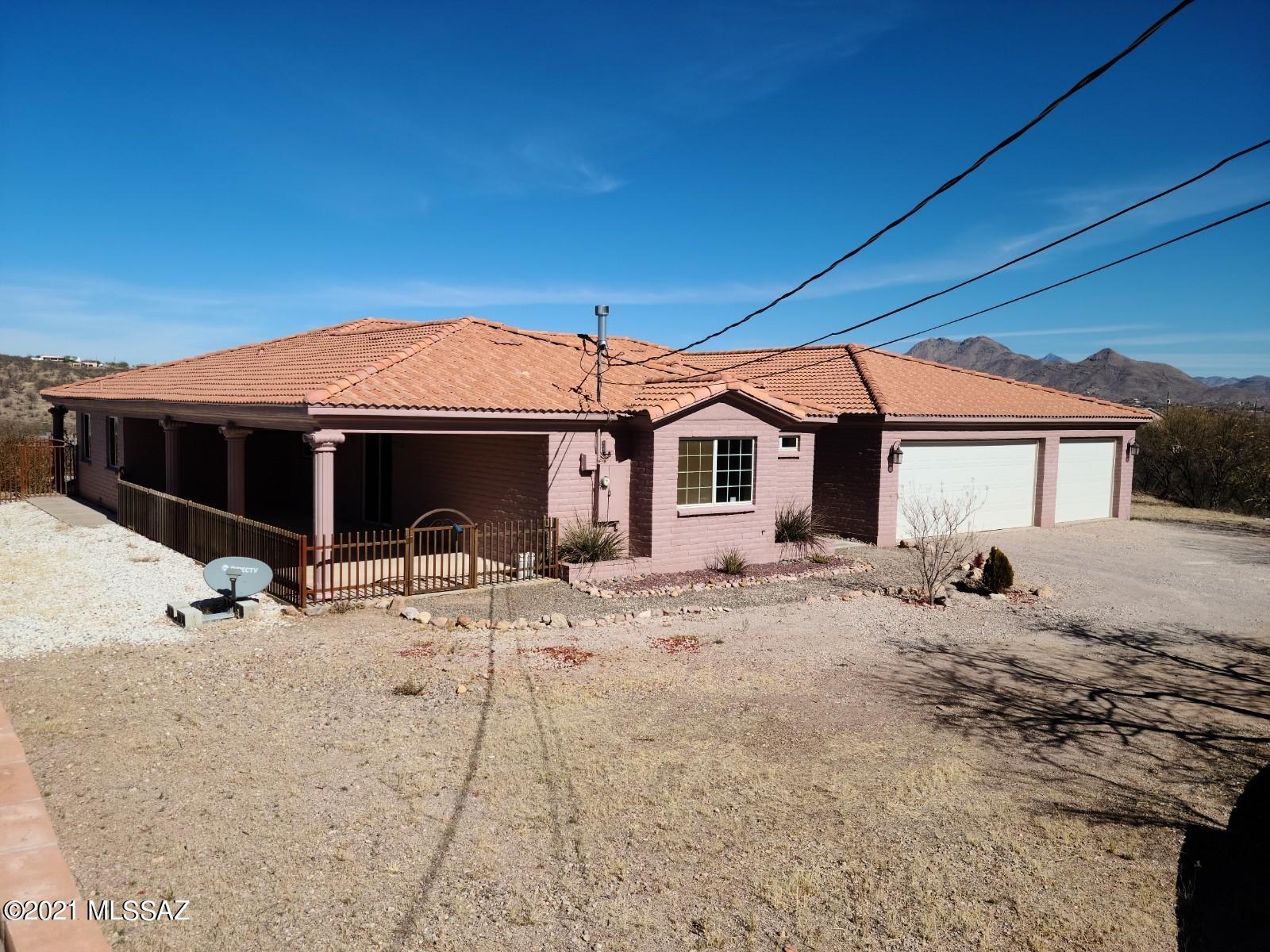 1038 Oso Court Rio Rico, AZ 85648 - Photo 3 of 50 a view of house with yard and sitting area