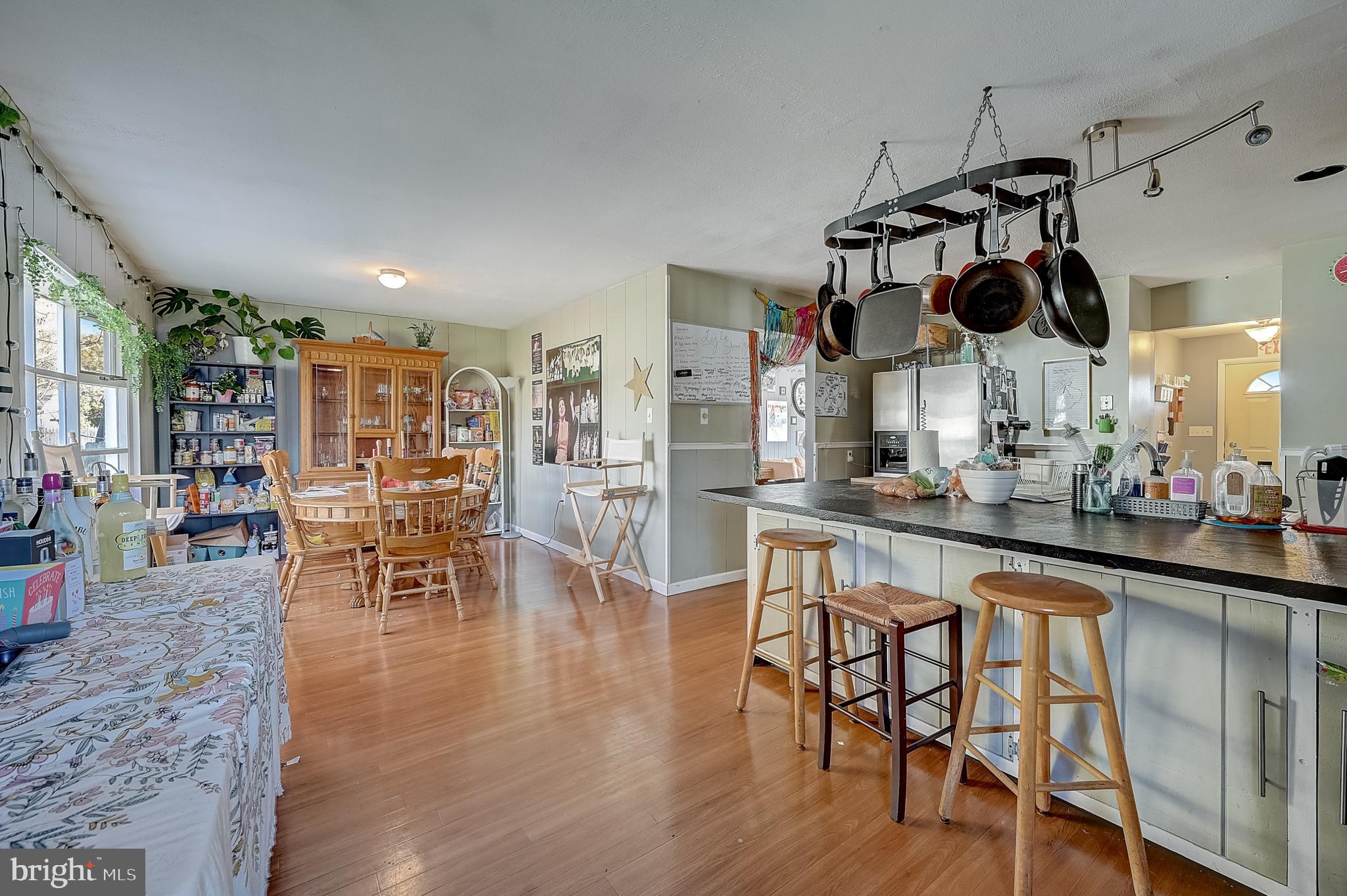 6 Rockland Road Ewing, NJ 08638 - Photo 18 of 37 a kitchen with stainless steel appliances granite countertop a table and chairs in it