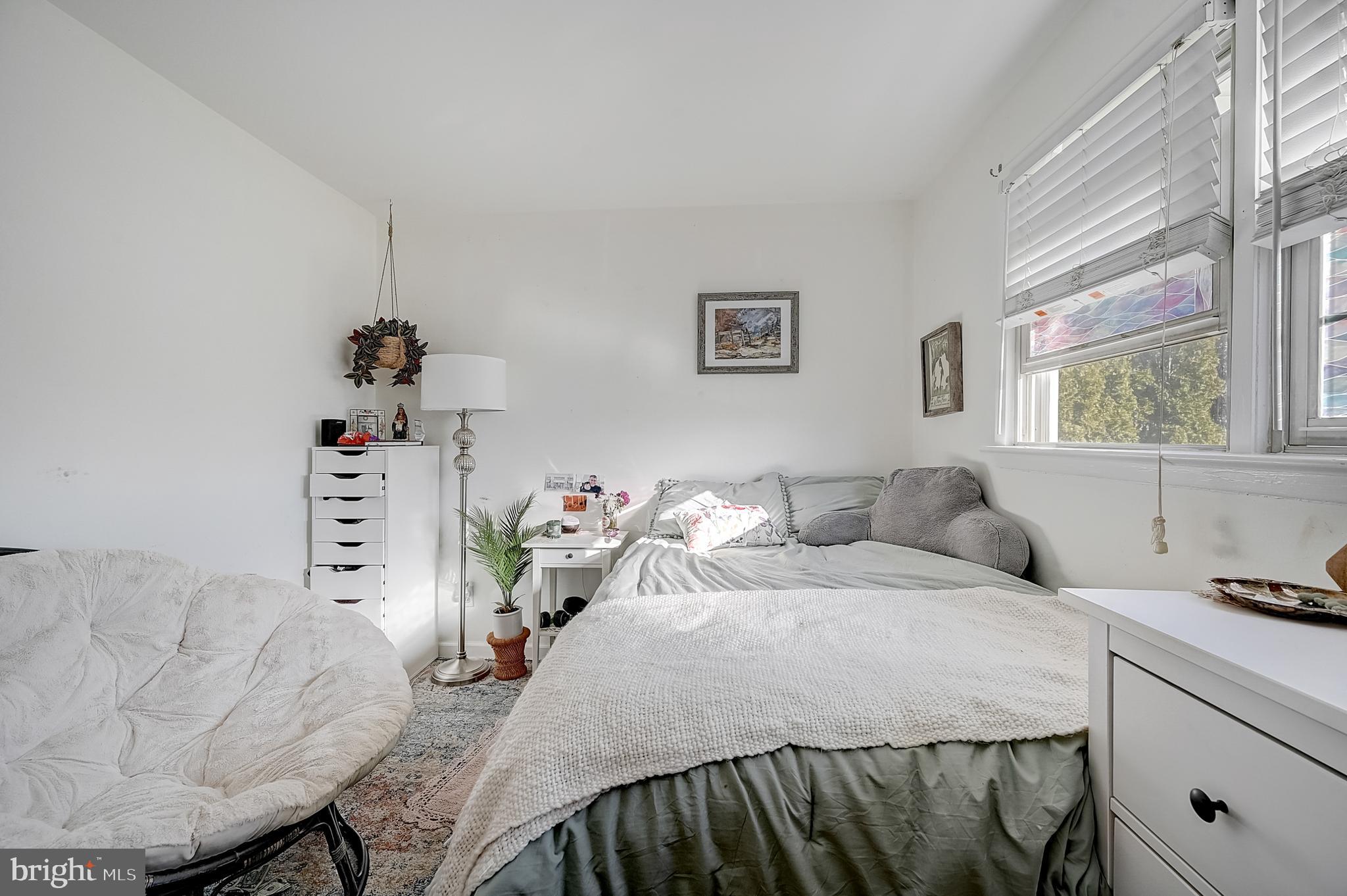 6 Rockland Road Ewing, NJ 08638 - Photo 25 of 37 a bedroom with a bed and a couch