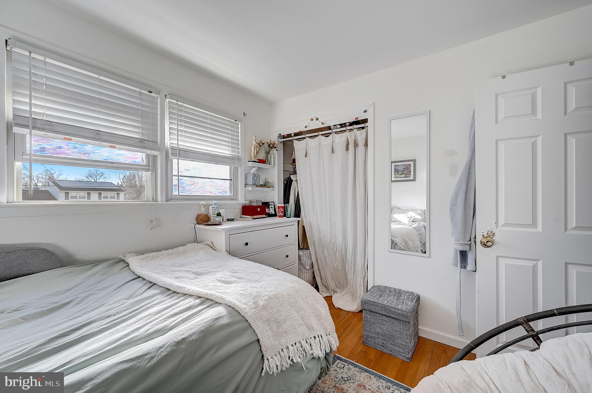 6 Rockland Road Ewing, NJ 08638 - Photo 26 of 37 a bedroom with a bed and a window with wooden floor