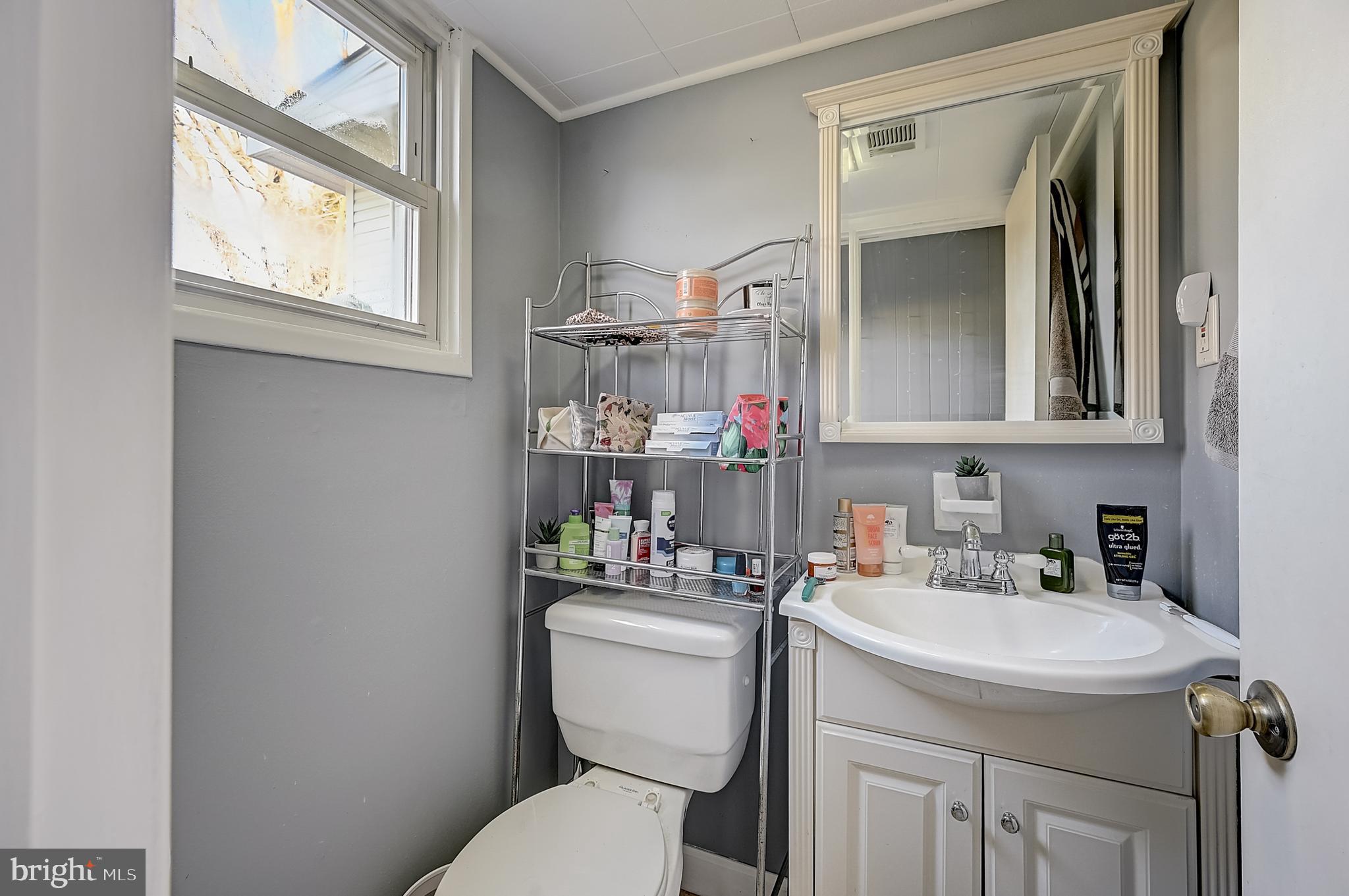 6 Rockland Road Ewing, NJ 08638 - Photo 27 of 37 a bathroom with a toilet sink and mirror