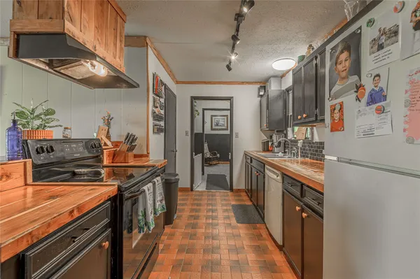 a kitchen with stainless steel appliances lots of counter top space