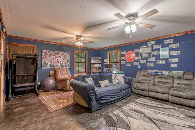 a living room with furniture and chandelier