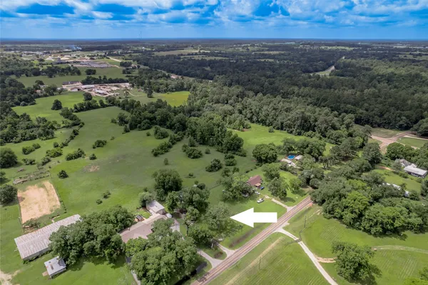 an aerial view of residential house with outdoor space