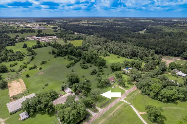 an aerial view of residential house with outdoor space