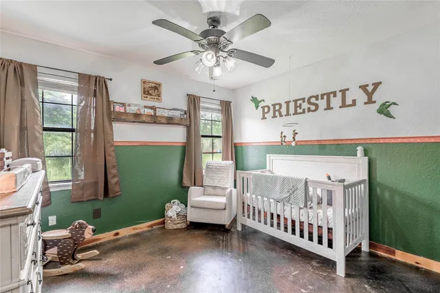 a bedroom with a bed and window