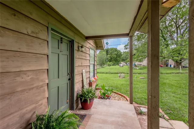 a view of a garden from a porch