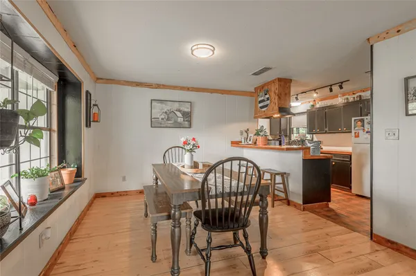 a dining room with furniture and window
