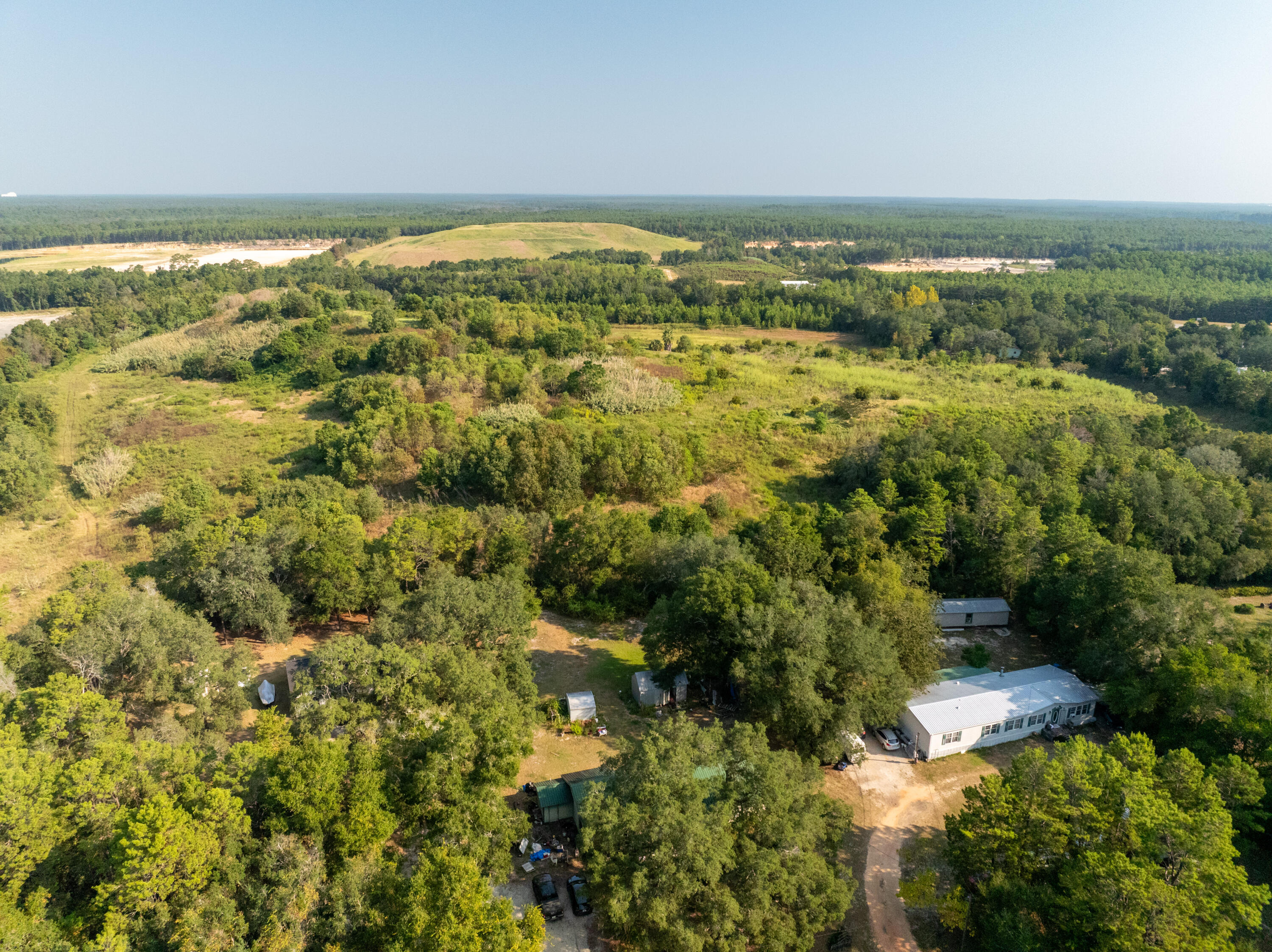 20 West Highway 20 Freeport, FL 32439 - Photo 17 of 24 an aerial view of residential houses with outdoor space and trees