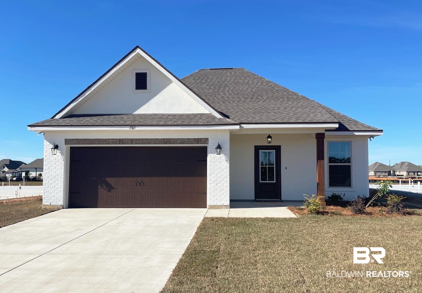 1363 Fenton Circle Foley, AL 36535 - Photo 1 of 20 View of front facade featuring a garage and a front lawn
