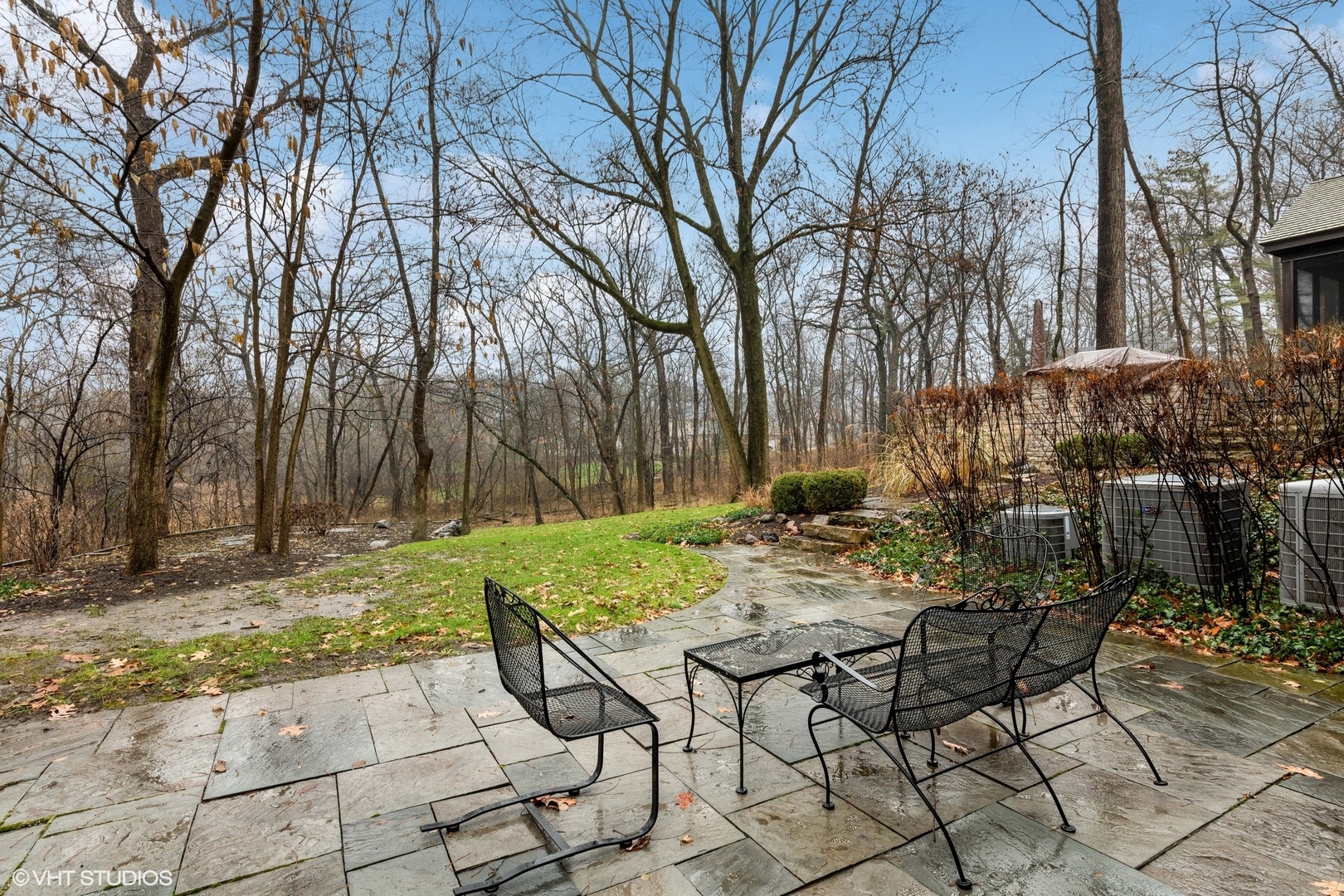 21447 North Andover Road Kildeer, IL 60047 - Photo 26 of 38 a view of backyard with table and chairs and wooden fence