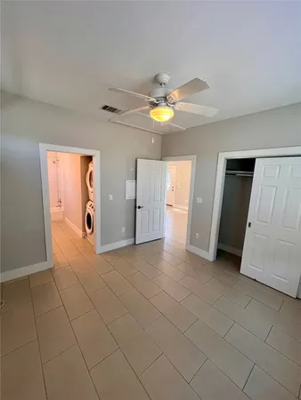 a view of an empty room with a bathroom