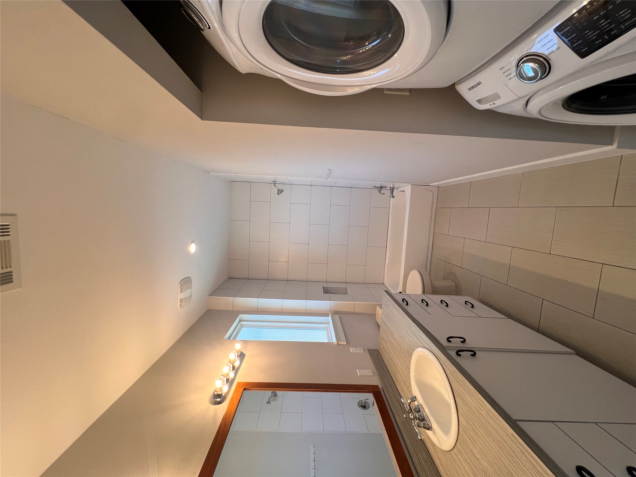 1101 Stobaugh Street, Unit B Austin, TX 78757 - Photo 12 of 21 a spacious bathroom with a sink a mirror and a bathtub