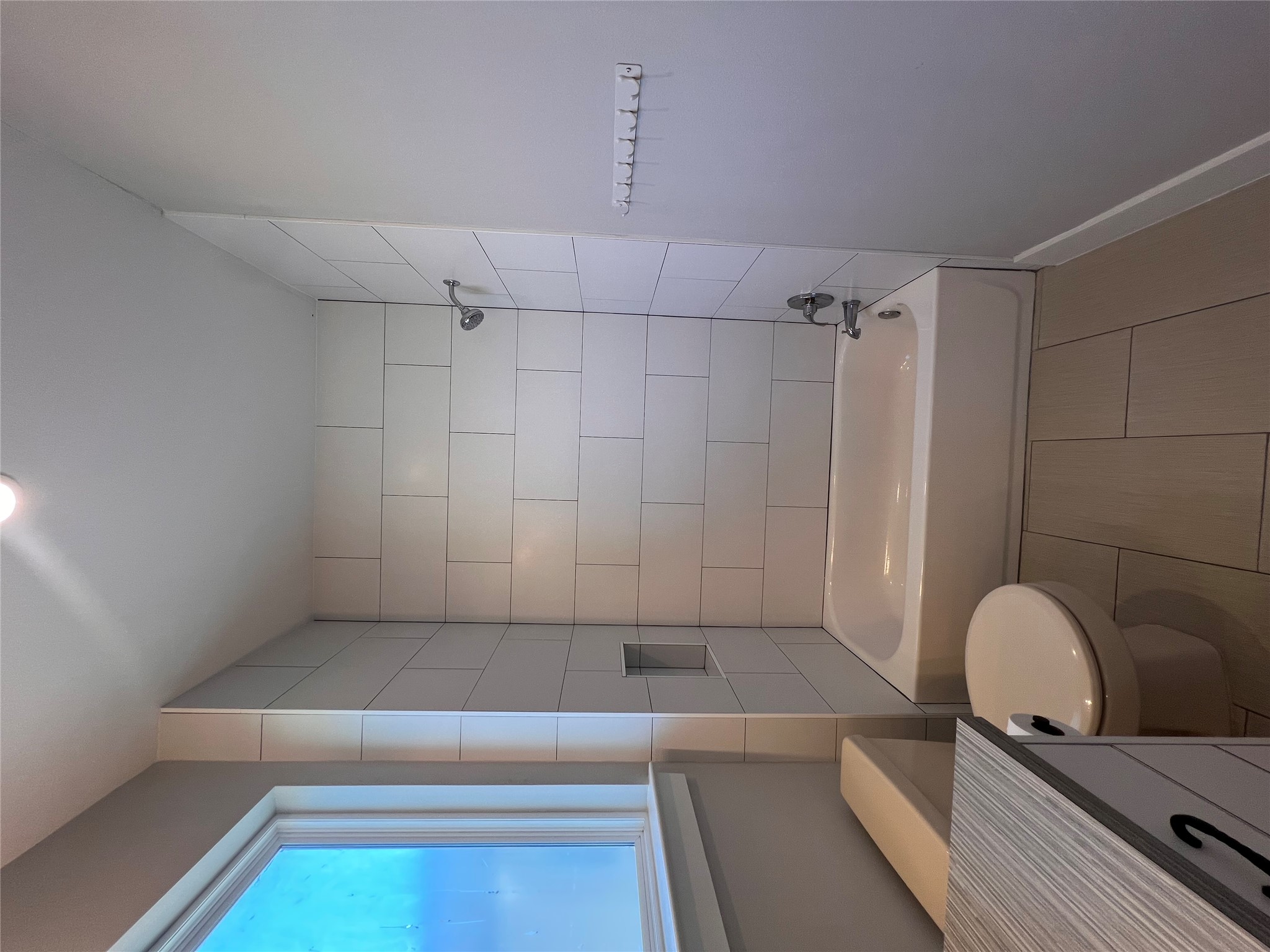 1101 Stobaugh Street, Unit B Austin, TX 78757 - Photo 14 of 21 a white bath tub sitting next to a toilet