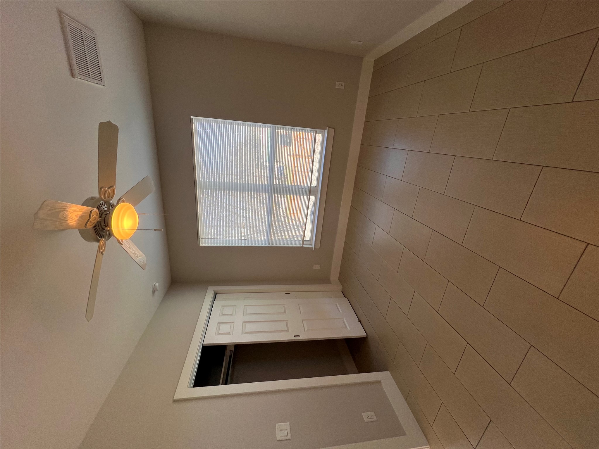 1101 Stobaugh Street, Unit B Austin, TX 78757 - Photo 16 of 21 a view of an empty room with a window