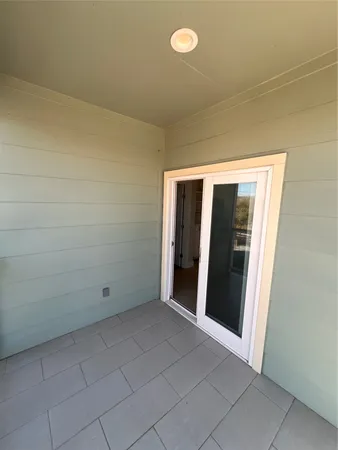 a kitchen with kitchen island granite countertop a stove a sink and a refrigerator