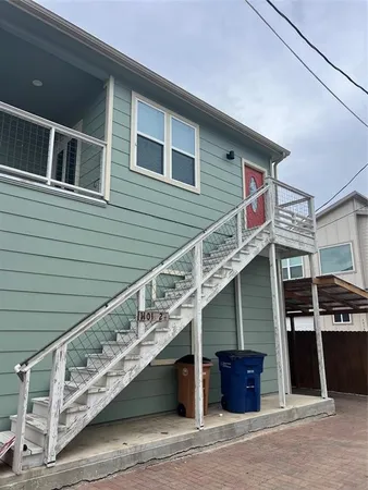 a front view of a house with garage