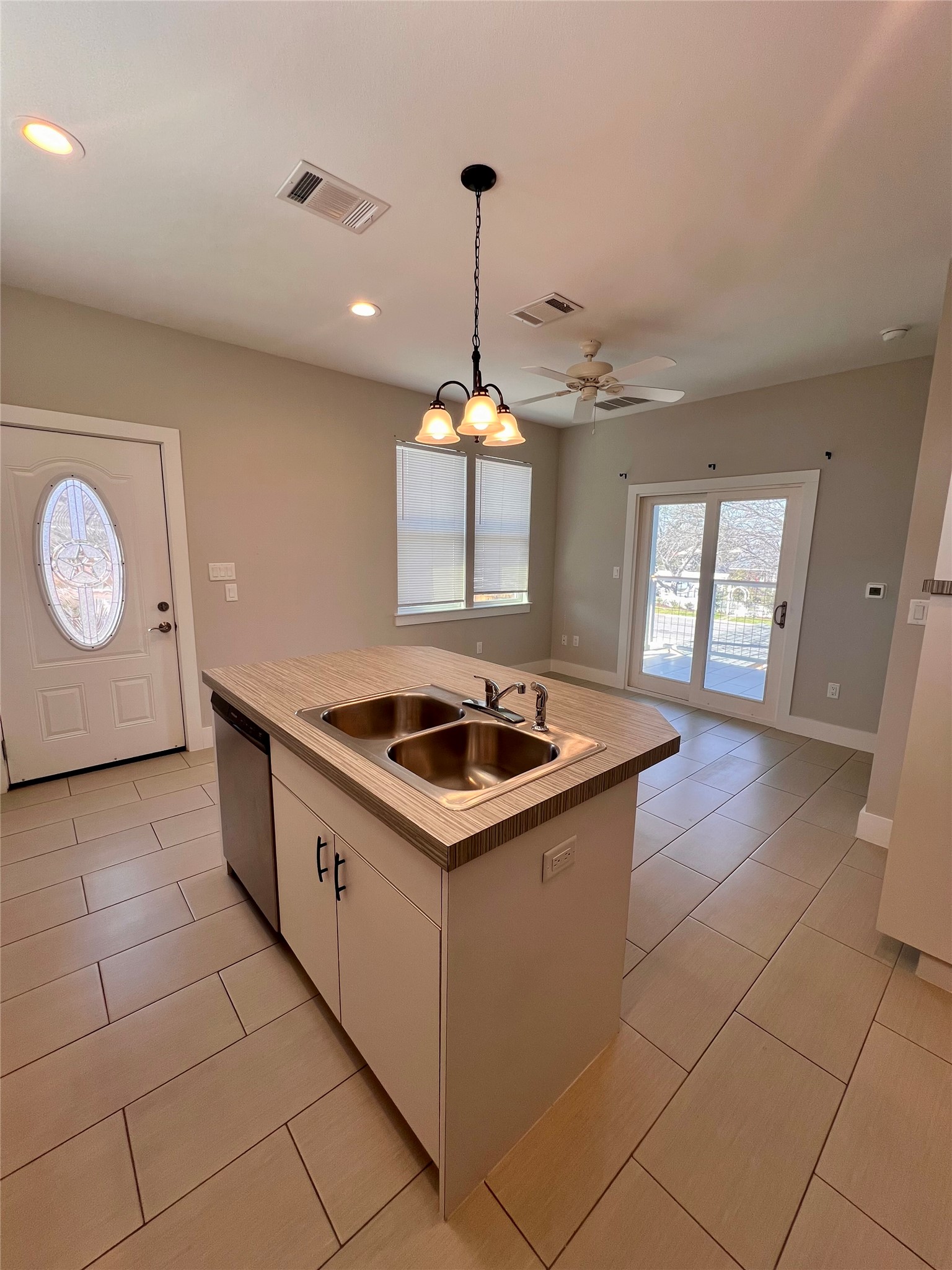 1101 Stobaugh Street, Unit B Austin, TX 78757 - Photo 21 of 21 a kitchen with a sink stove and cabinets