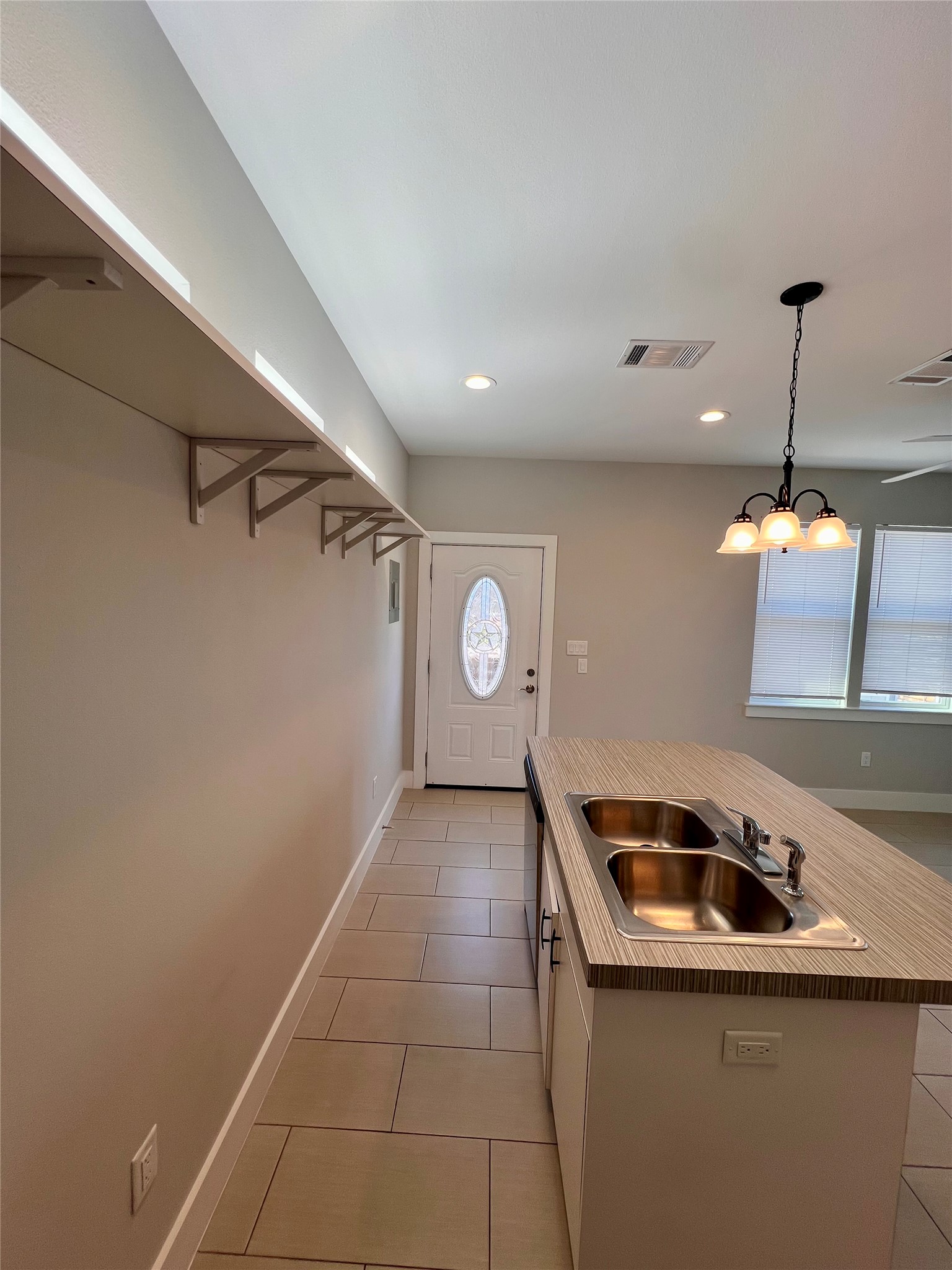 1101 Stobaugh Street, Unit B Austin, TX 78757 - Photo 6 of 21 a kitchen that has a sink and a stove