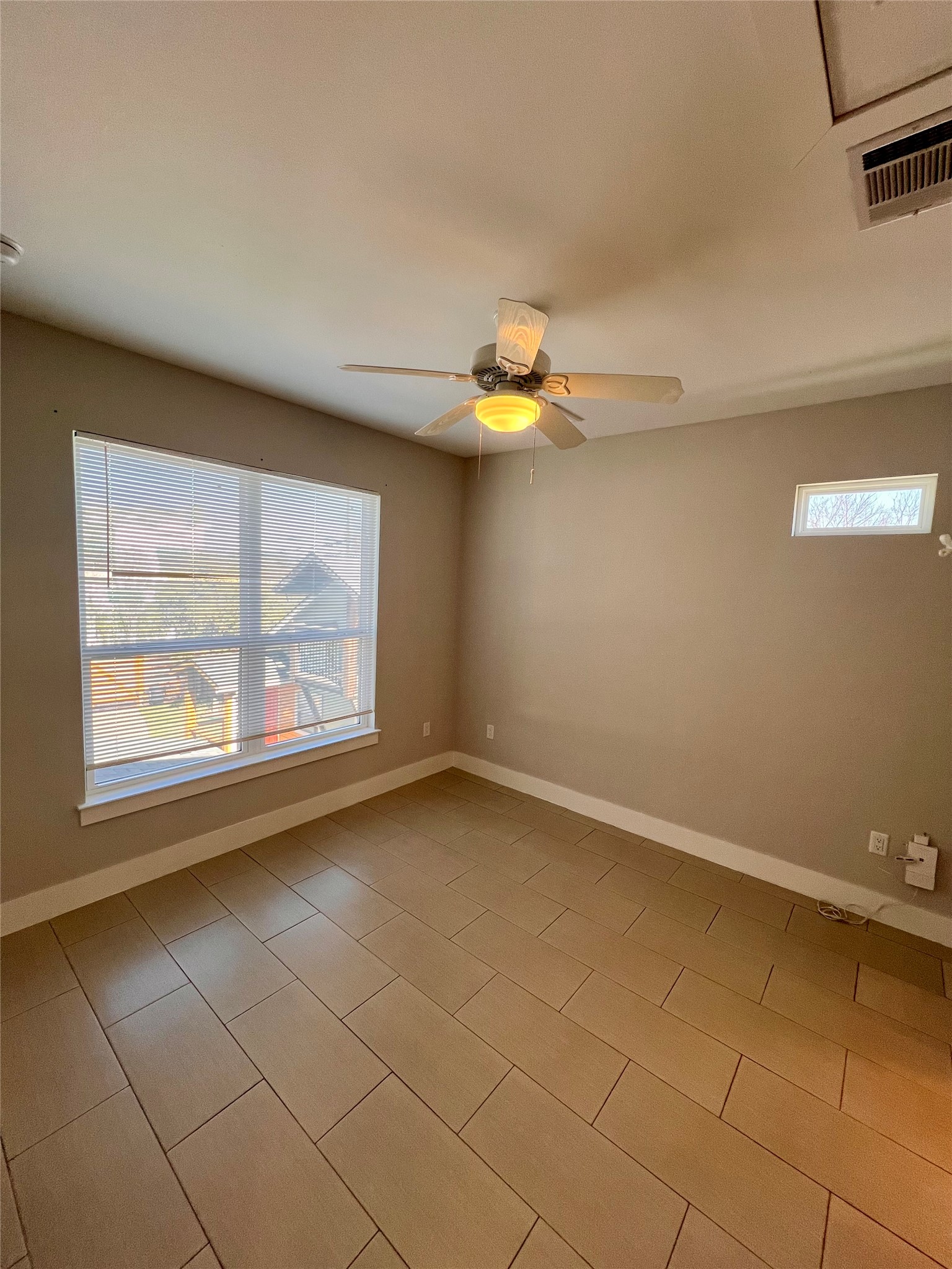 1101 Stobaugh Street, Unit B Austin, TX 78757 - Photo 10 of 21 a view of an empty room with a window