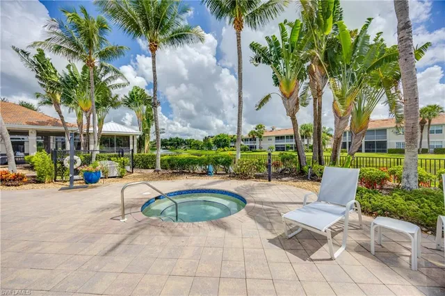 an aerial view of a house with yard swimming pool and outdoor seating