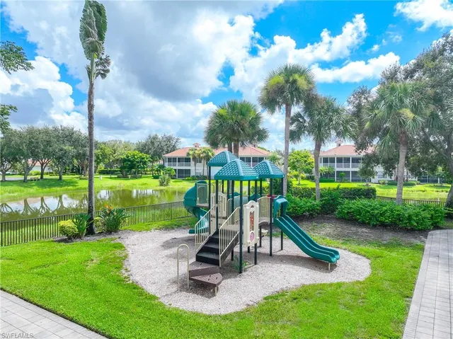 an aerial view of a house with a yard basket ball court and outdoor seating