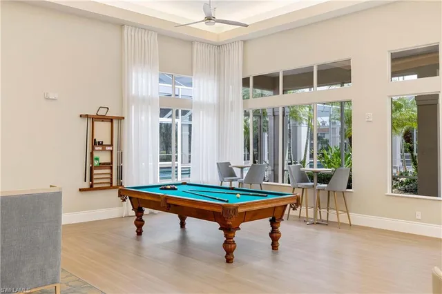 a living room with dining room and lots of furniture