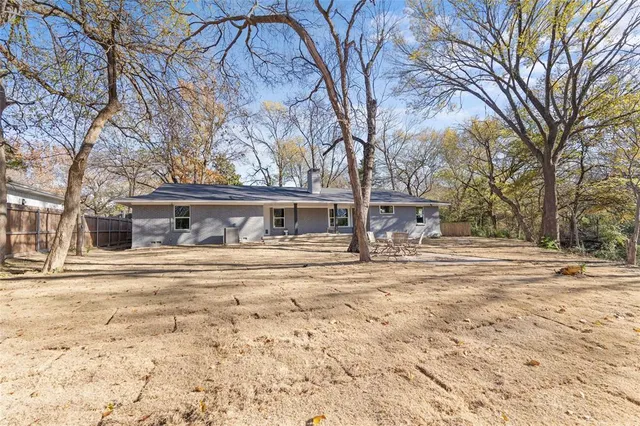 a view of a house with snow on the road