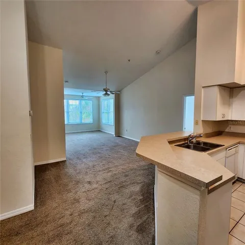 an empty room with a empty space and windows