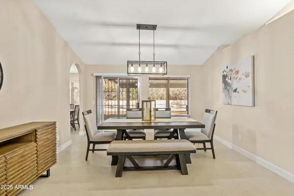 a view of a dining room with furniture window and outside view