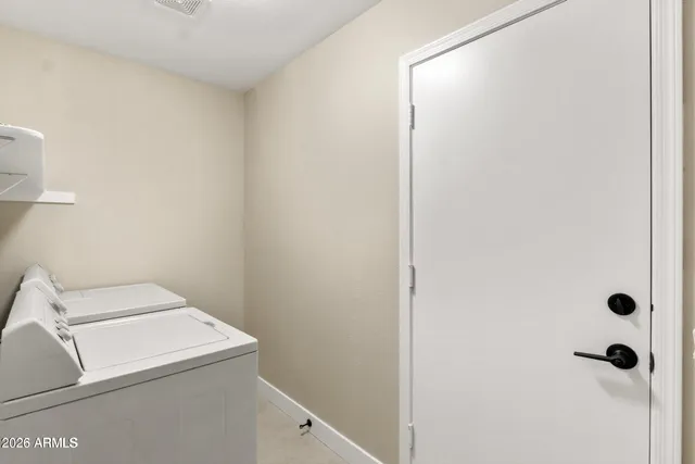 a utility room with dryer and washer