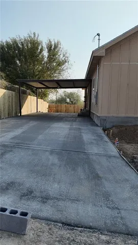 a view of a back yard of the house