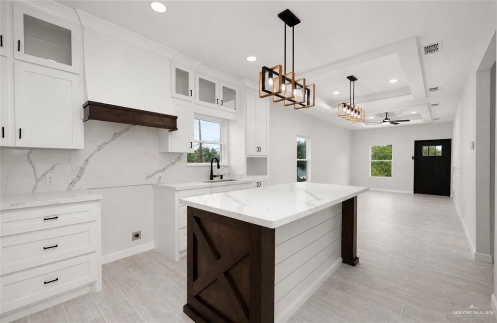 352 Elias Lopez Street Rio Grande City, TX 78582 - Photo 6 of 15 a kitchen with a sink a counter space and stainless steel appliances