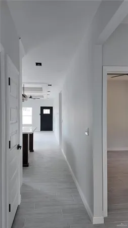 a view of a hallway with an entryway