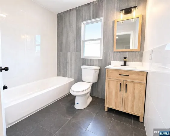 a bathroom with a sink toilet and bathtub