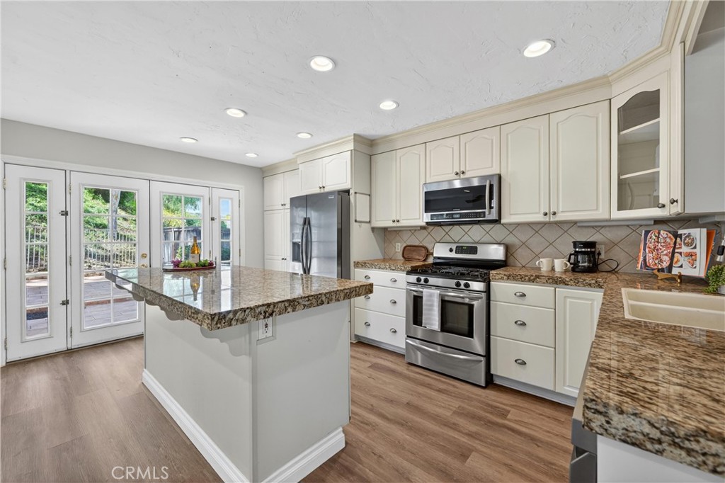 11562 Chadwick Road Corona, CA 92878 - Photo 7 of 39 Kitchen and french doors to backyard. Beautiful view
