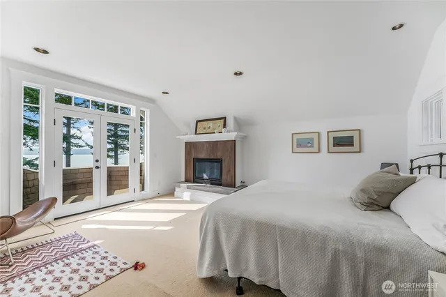 a bedroom with a large bed and a window