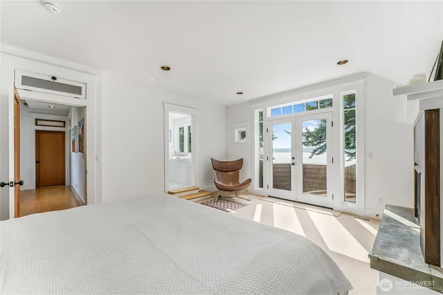 a bedroom with furniture and a window