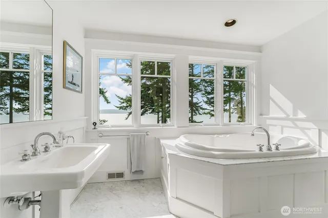 a bedroom with a bed and chair