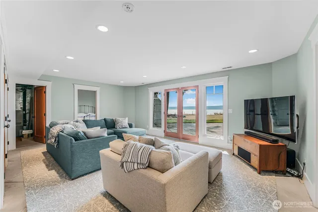 a living room with furniture window and a flat screen tv