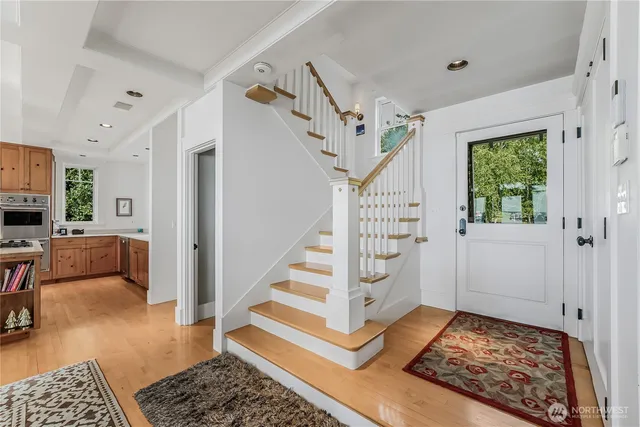a view of a livingroom with furniture and staircase