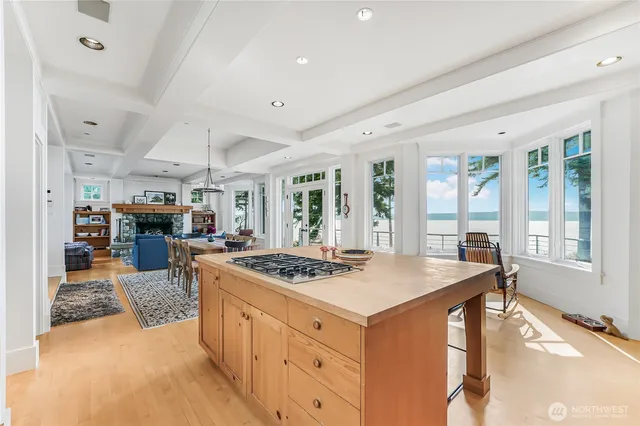 a kitchen with stainless steel appliances granite countertop a stove and a refrigerator