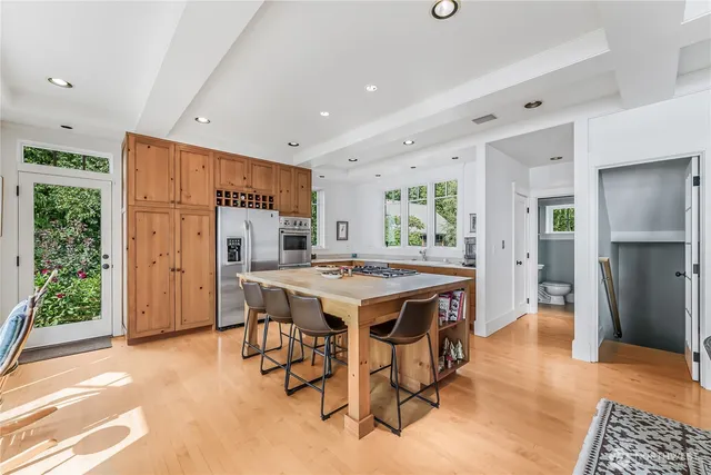 a kitchen that has a table and chairs in it
