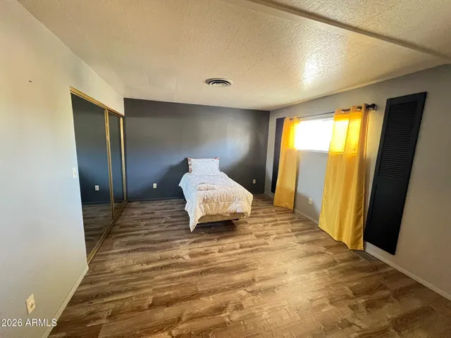 a view of a livingroom with wooden floor