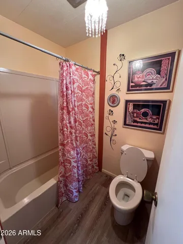 a bathroom with a toilet a sink and bathtub