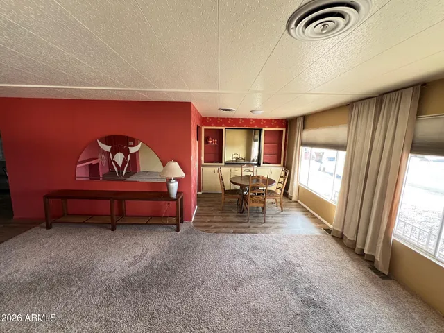 a reading room with furniture and a window