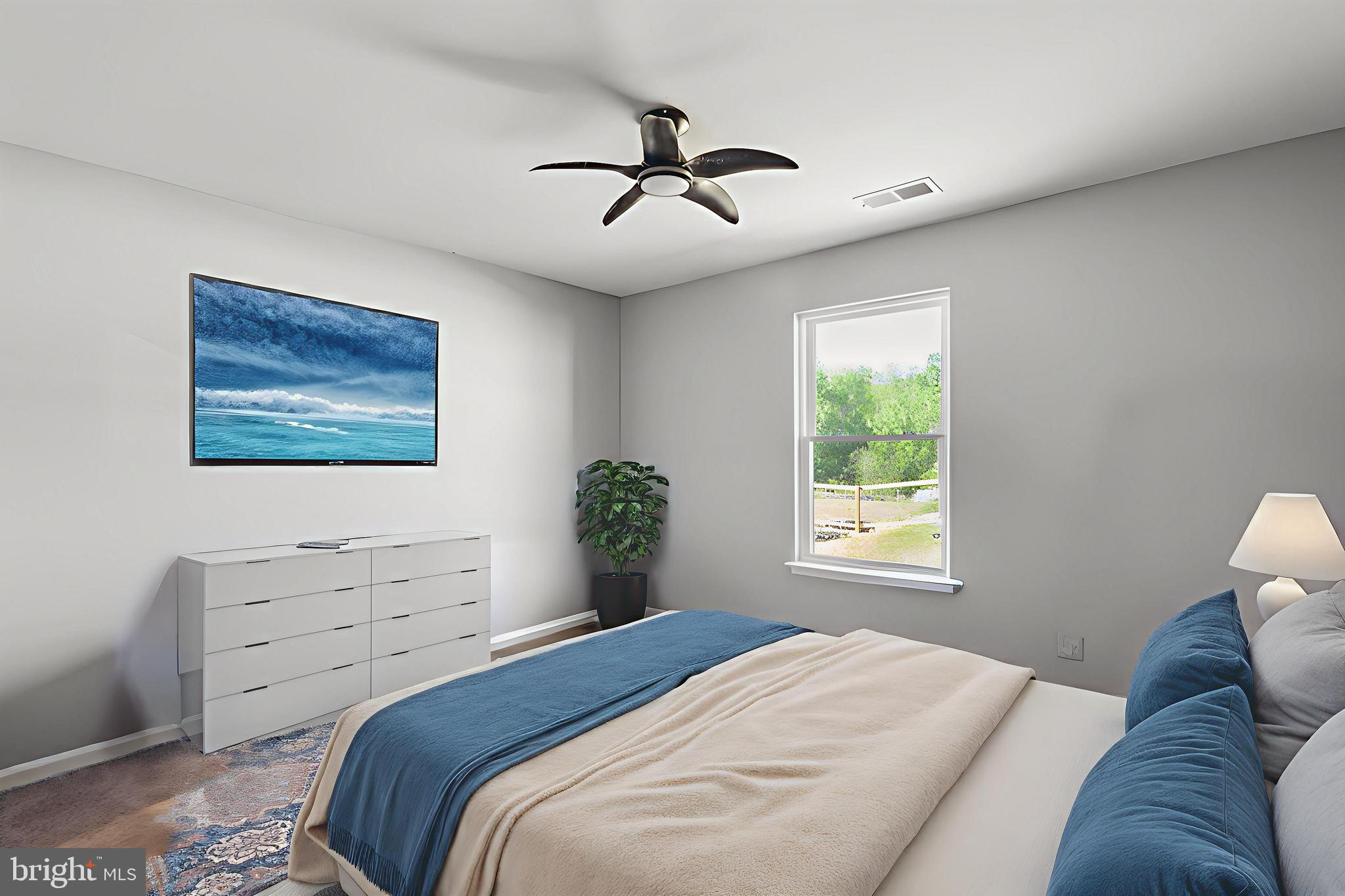 17026 Rollins Road Bowling Green, VA 22427 - Photo 11 of 19 a bedroom with a bed and a window
