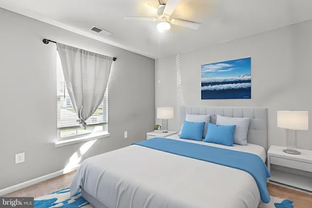 a bedroom with a large bed and a window