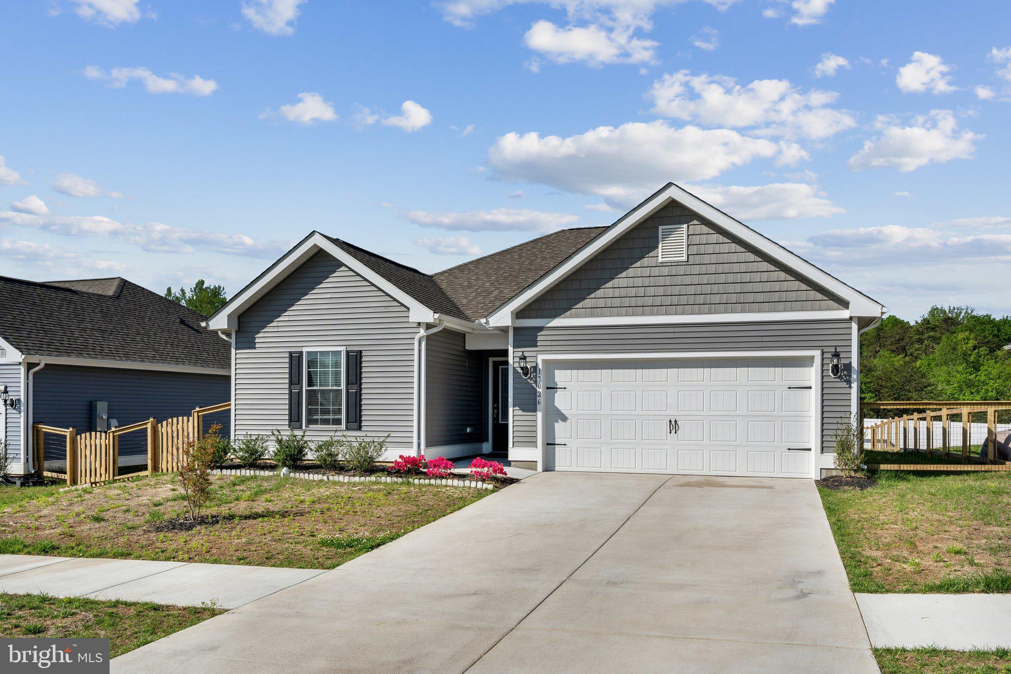 17026 Rollins Road Bowling Green, VA 22427 - Photo 2 of 19 a view of a house with a yard and fence